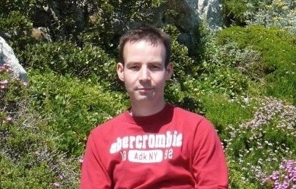 Man wearing red t-shirt in a bright light