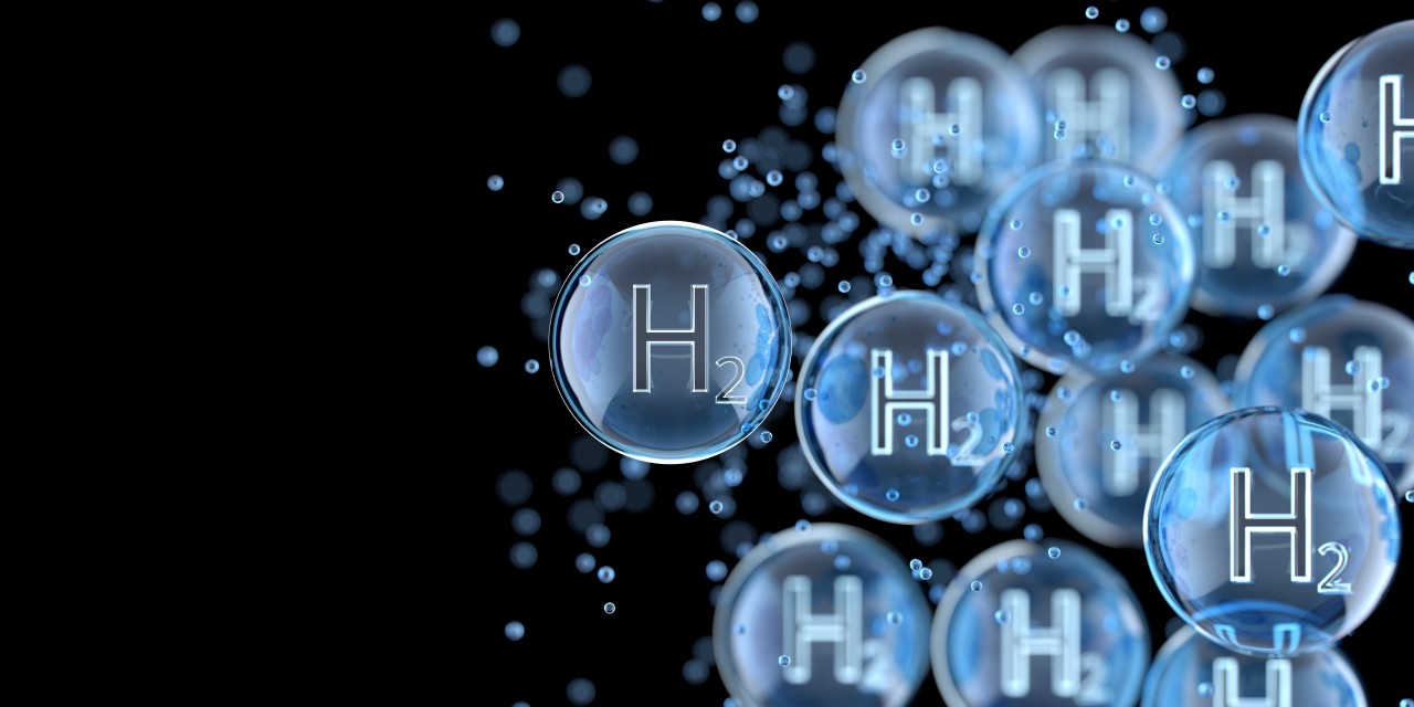 Blue hydrogen H₂ molecules floating against a dark background, representing hydrogen as a clean energy source