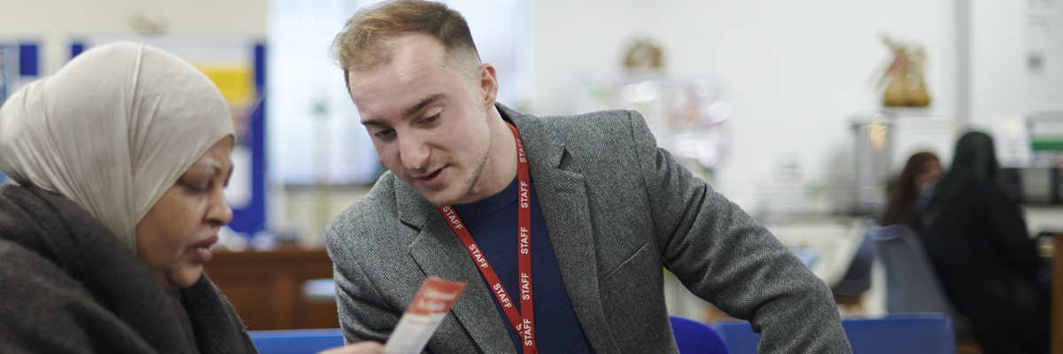 Staff member helping a customer during an advice session.