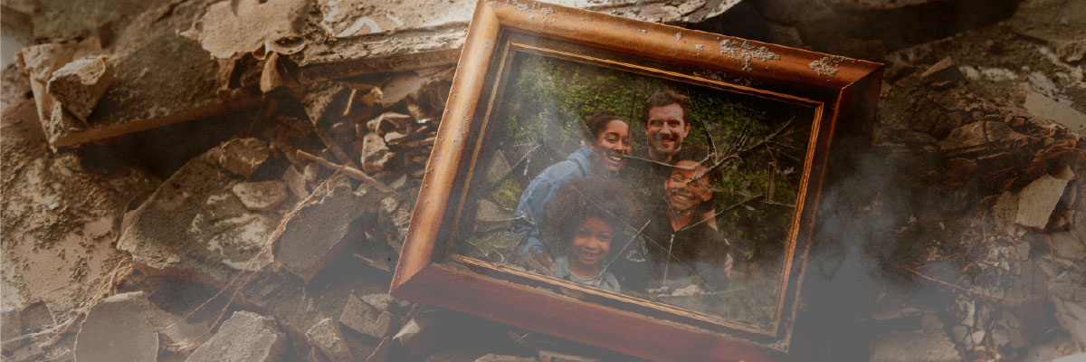 Broken family photo frame amid rubble