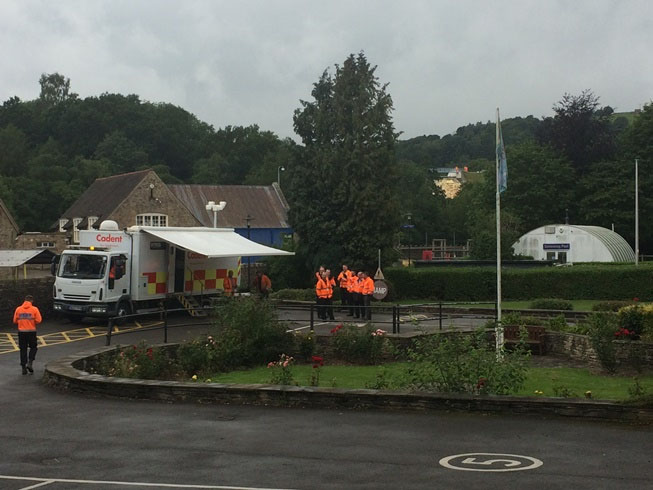 Cadent team gathered near a mobile operations truck in a village area.