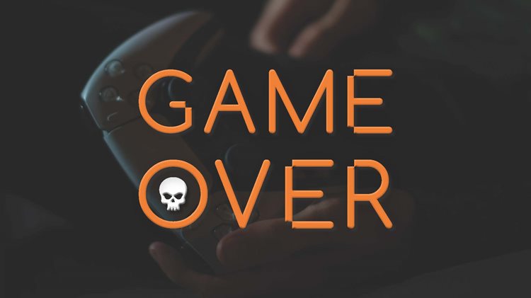 Dark image of a game controller held in hands, overlaid with bold orange text 