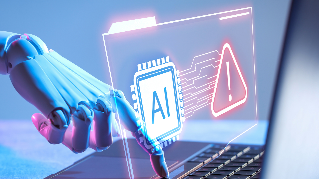 Neon-lit robotic hand points to an AI microchip and warning symbol above a laptop keyboard, suggesting digital risk and caution needed.