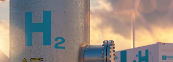 A realistic industrial hydrogen storage facility with an H₂ tank, connected piping, and wind turbines in the background, representing clean energy and green hydrogen infrastructure.