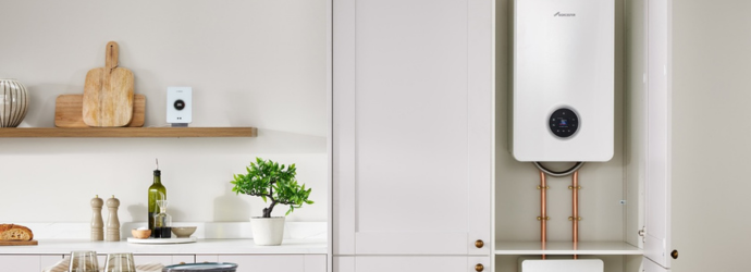 Modern kitchen featuring a white cabinet with a sleek boiler inside. Shelves with decor and cookware add warmth to the clean, minimalist space.